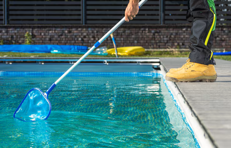 Net Cleaning -- caucasian-professional-pool-worker-with-pool-net-cleaning-residential-outdoor-swimming-pool_1426-24270